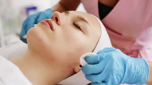 Woman Receives Facial Treatment at Spa
