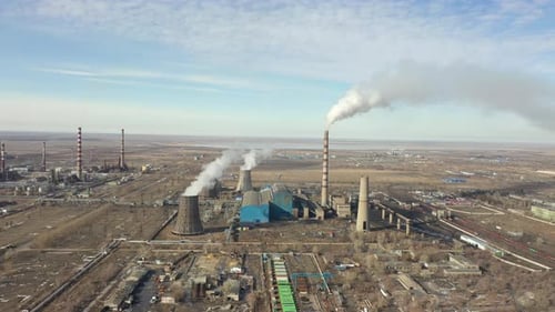 Aerial View of Thermal Power Plant Drone Flies Over Chimney Smoke Pipes and Cooling Towers of