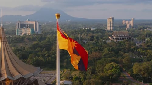 Sarawak Flag and Assembly Dome at Sunset