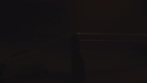 close up of old violin, dramatic light changes over the instrument , classical symphony music video