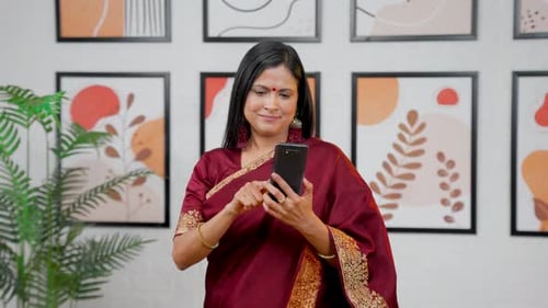 Woman Using Smartphone in Modern Home