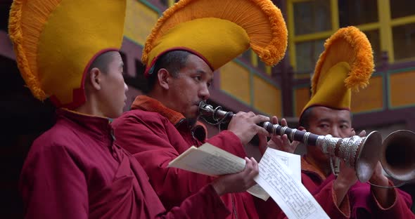 Buddhist Monk in Nepal doing musical Prayer, playing musical instrument ...