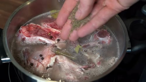Seasoning Meat in Boiling Pot for Delicious Bone Broth