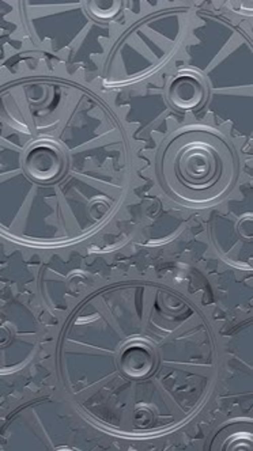 Intricate Array of Rotating Interlocking Metal Gears in CloseUp View