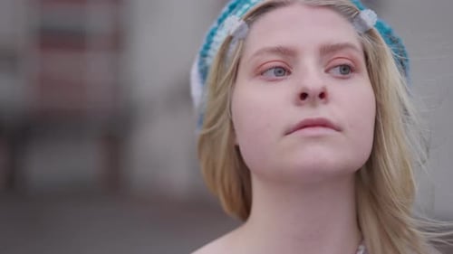Young Woman Posing with Knit Cap Outdoors