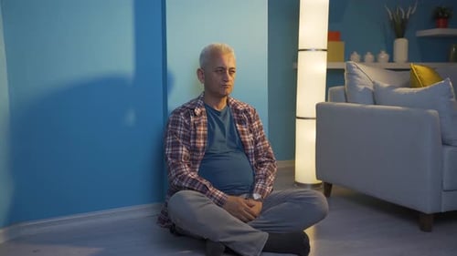 Depressed man shaking his head with negative expression.