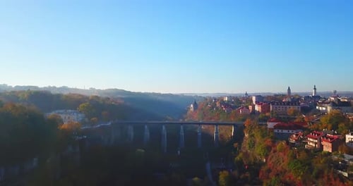 Aerial View of City With Bridge and Nature