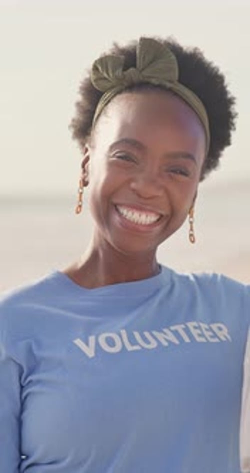 Woman, face and volunteer on beach for pollution community service, environment or sustainability