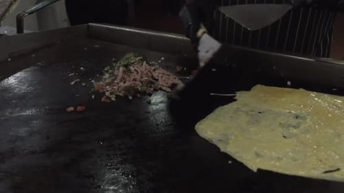 Chef Making Omelet in a Hotel Kitchen