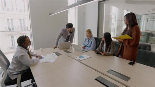 The Collaboration of Diverse Teams Within a Modern Office Setting Enhances Innovation and Ideas