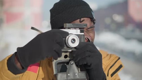 Man Taking Pictures with an Old Camera
