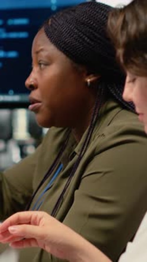 Vertical Video Software Developers in Startup Office Brainstorming Leveraging AI Tech