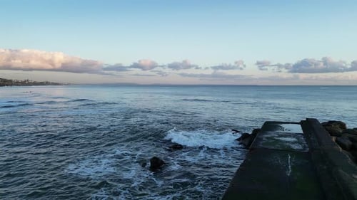 Flying Close To Shore Over A Pier In Portugal