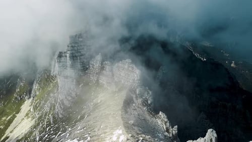 Aerial view of scenic mountain range in the Italian alps with a bivouac on top