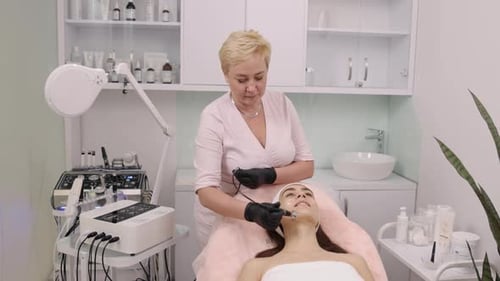 Woman Receiving Facial Treatment in Medical Office