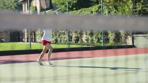 Woman playing tennis on the tennis court