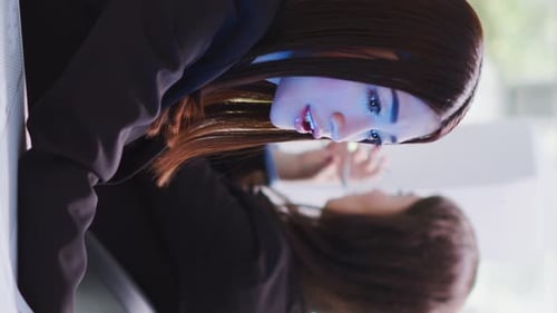 Vertical Video Developer Talking to Consultant on Holographic Projection