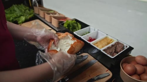 Preparing and Spreading Filling on a Bread Roll