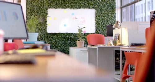 Office interior with green wall and whiteboard, slow motion