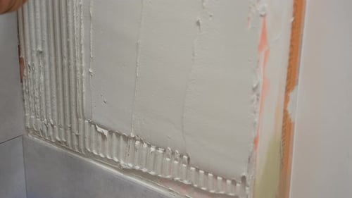 Applying Tile Mortar to a Wall for Tiling