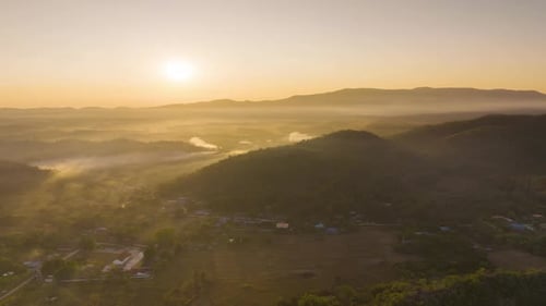 Aerial view Beautiful of morning scenery Golden light sunrise And the mist flows on high mountains.