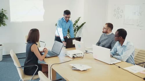 Business Team Discuss New Projects Uses a Laptop in the Office Business Concept Metting Project