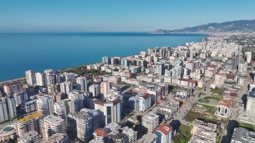 Aerial Video of a Luxury FirstLine Beach Complex With White Buildings Lush Gardens and Direct