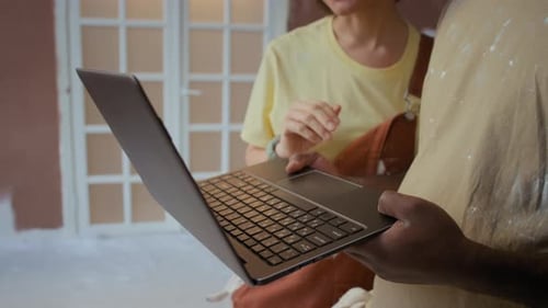 Couple Renovating Home Interior Planning Decoration Using Laptop