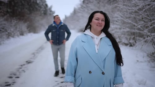 A Married Couple is Admiring the Winter Landscape