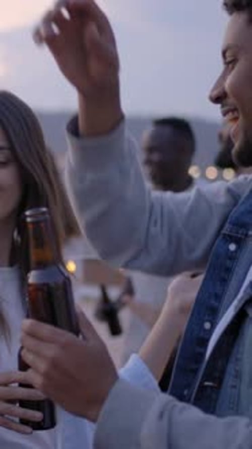 Friends Celebrating Outdoors with Beer Bottles