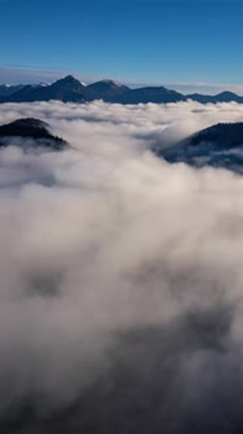 Scenic Aerial View of Fog Shrouded Mountain Peaks