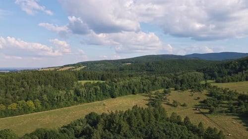 Aerial View of Countryside Area with Agricultural Fields Near Mountains