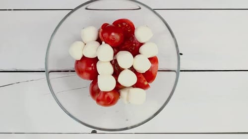 Preparing Fresh Caprese Salad With Tomatoes and Mozzarella