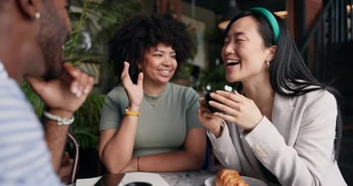 People, friends and laughing with coffee at cafe for funny joke, discussion or break together