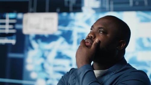 African American IT Specialist Examining Artificial Intelligence Interface