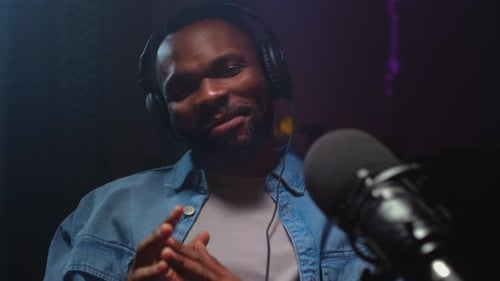 Man with Microphone Recording Podcast in Studio