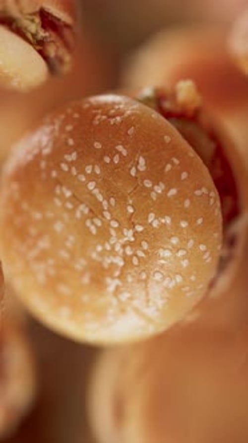 Animation of a group of burgers. Defocus. Close-up.