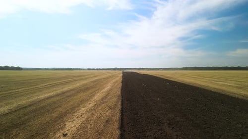 Tractors plowing the field in Ukraine