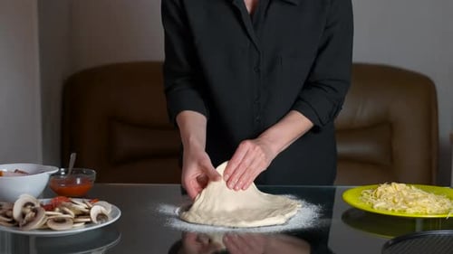 Female Shapes the Dough Like Pizza