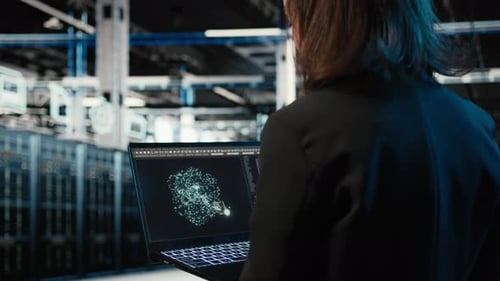 Data Center Female Programmer Using AI LLM Model on Laptop