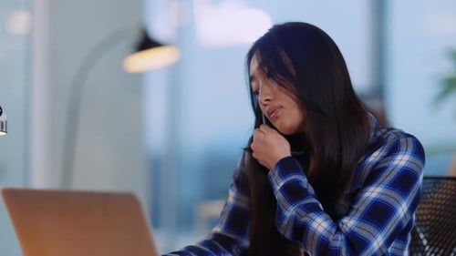 Asian Young Woman Office Manager Dialing Business Colleague on Mobile Phone Talking Writing Notes on