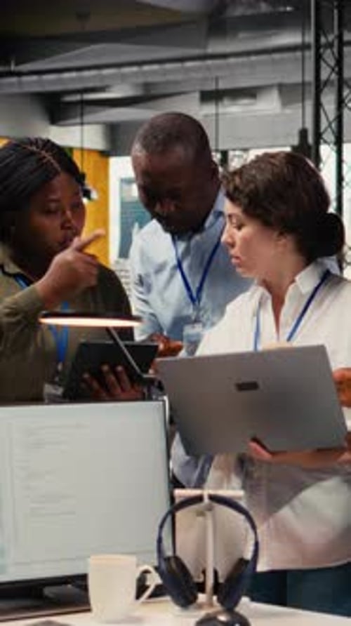 Vertical Video Engineering Team in Startup Office Working with AI Technology