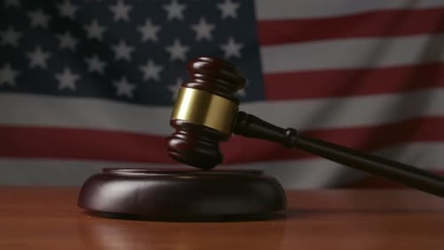 Judge's Gavel on the Background of the Flag of the United States of America