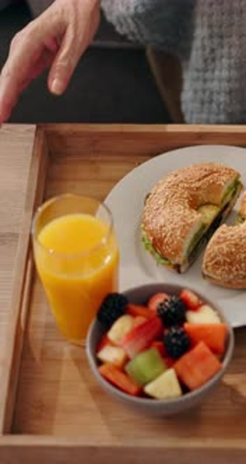 Breakfast Tray with Bagel, Fruit, and Orange Juice