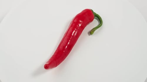 Rotating Red Chili Pepper on White Background