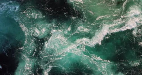 Blue waves of water of the river and the sea meet each other during high tide and low tide.