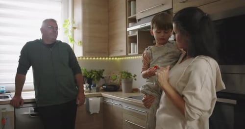 Family together in kitchen at home during day