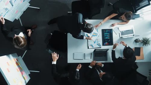 Top view of smart diverse leader present marketing plan at meeting. Directorate.