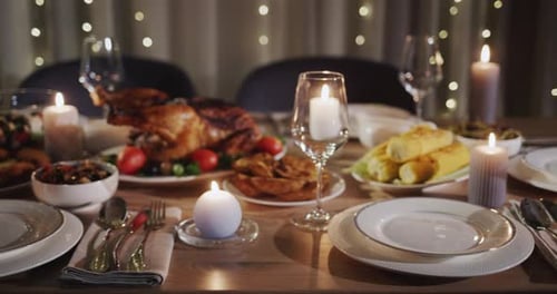 Thanksgiving Holiday Table with Turkey in the Center of the Table