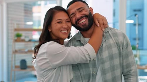 Happy Couple Embracing in Their Home